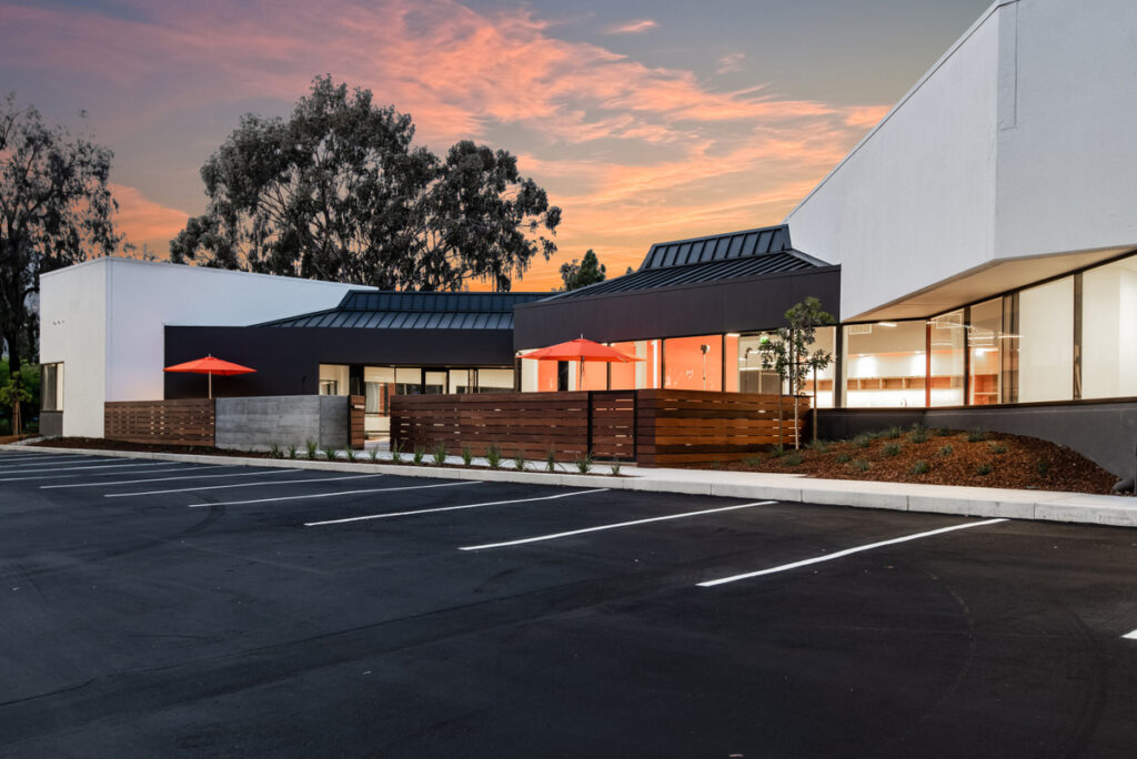Modern office park exterior at sunset
